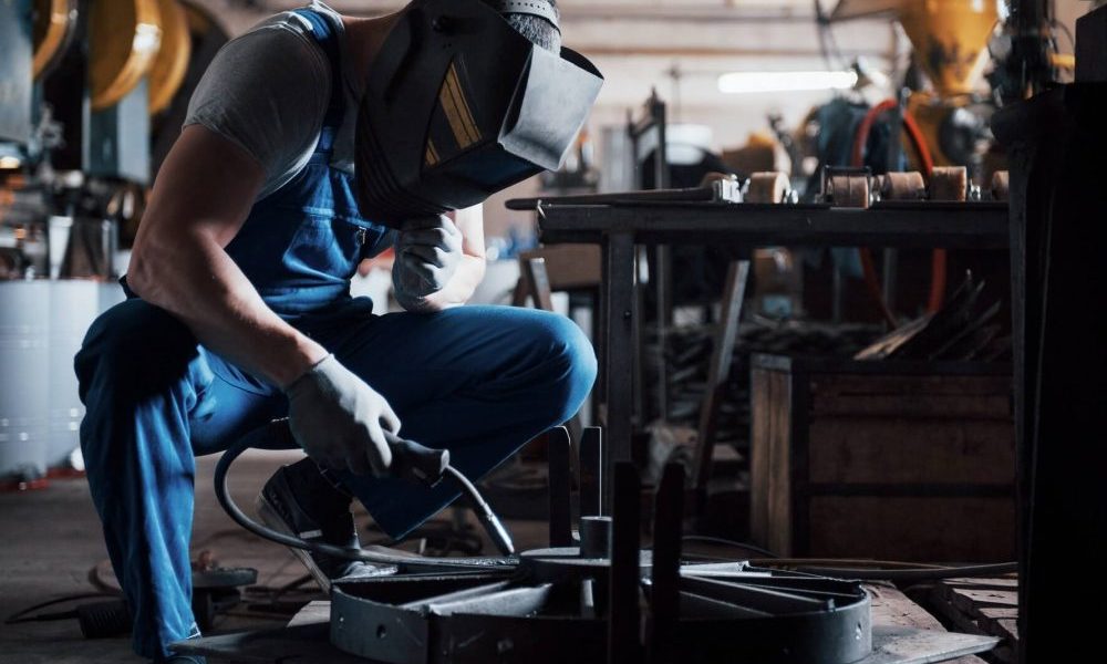 portrait-of-a-young-worker-at-a-large-metalworking-plant-the-welder-engineer-works-in-a-protective-1-qvk9259207ipg29gsxcls10zr3gy870ivzkvry7fbg